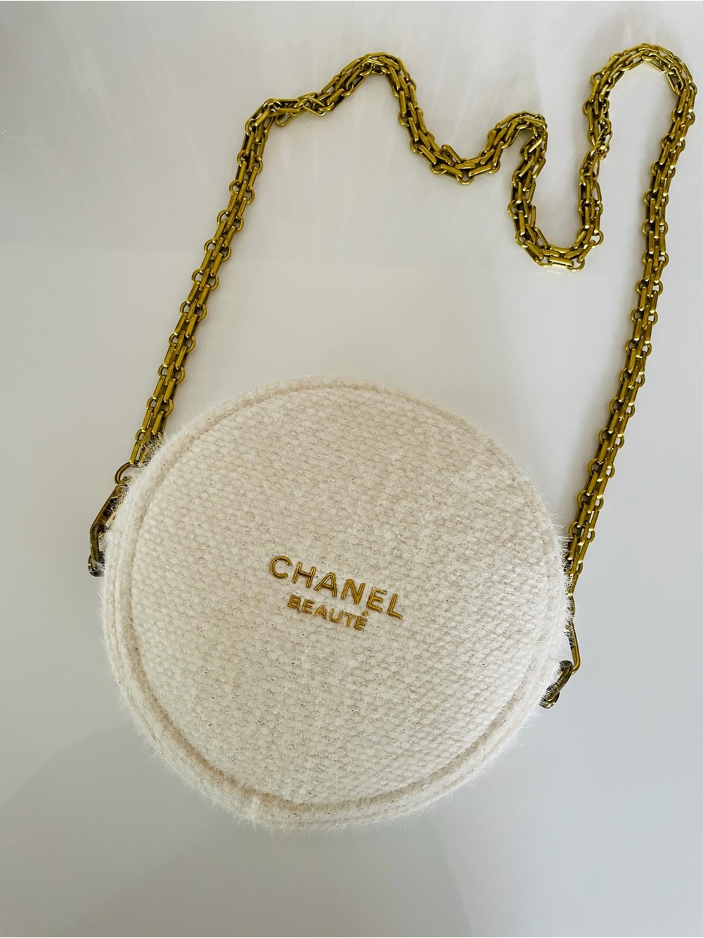 Chanel Beauté round crossbody bag in cream with gold chain LOGO designer